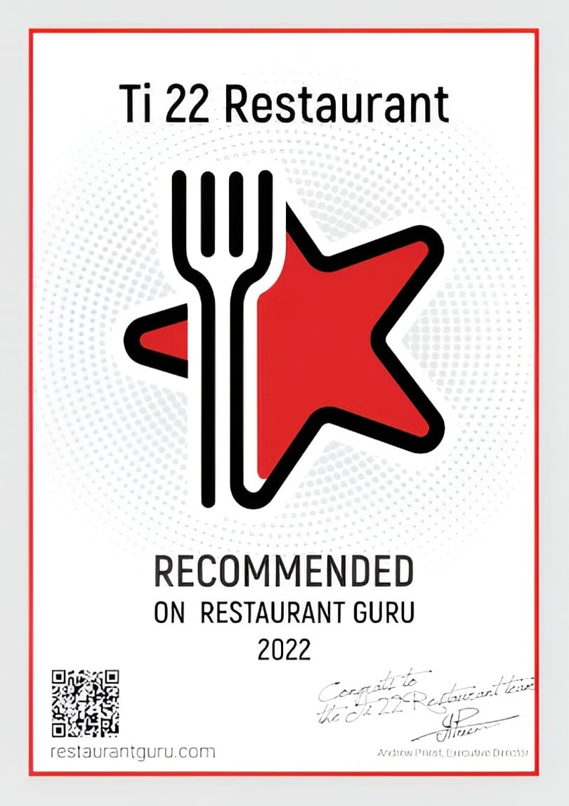 Ti 22 Restaurant's 2022 Restaurant Guru recommendation certificate, featuring a fork and red star logo.