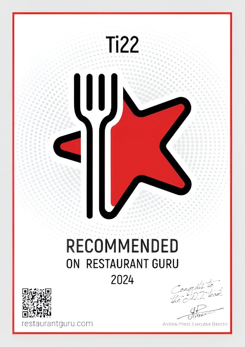 Ti22 restaurant received a "Recommended on Restaurant Guru 2024" award, featuring a fork and red star logo.